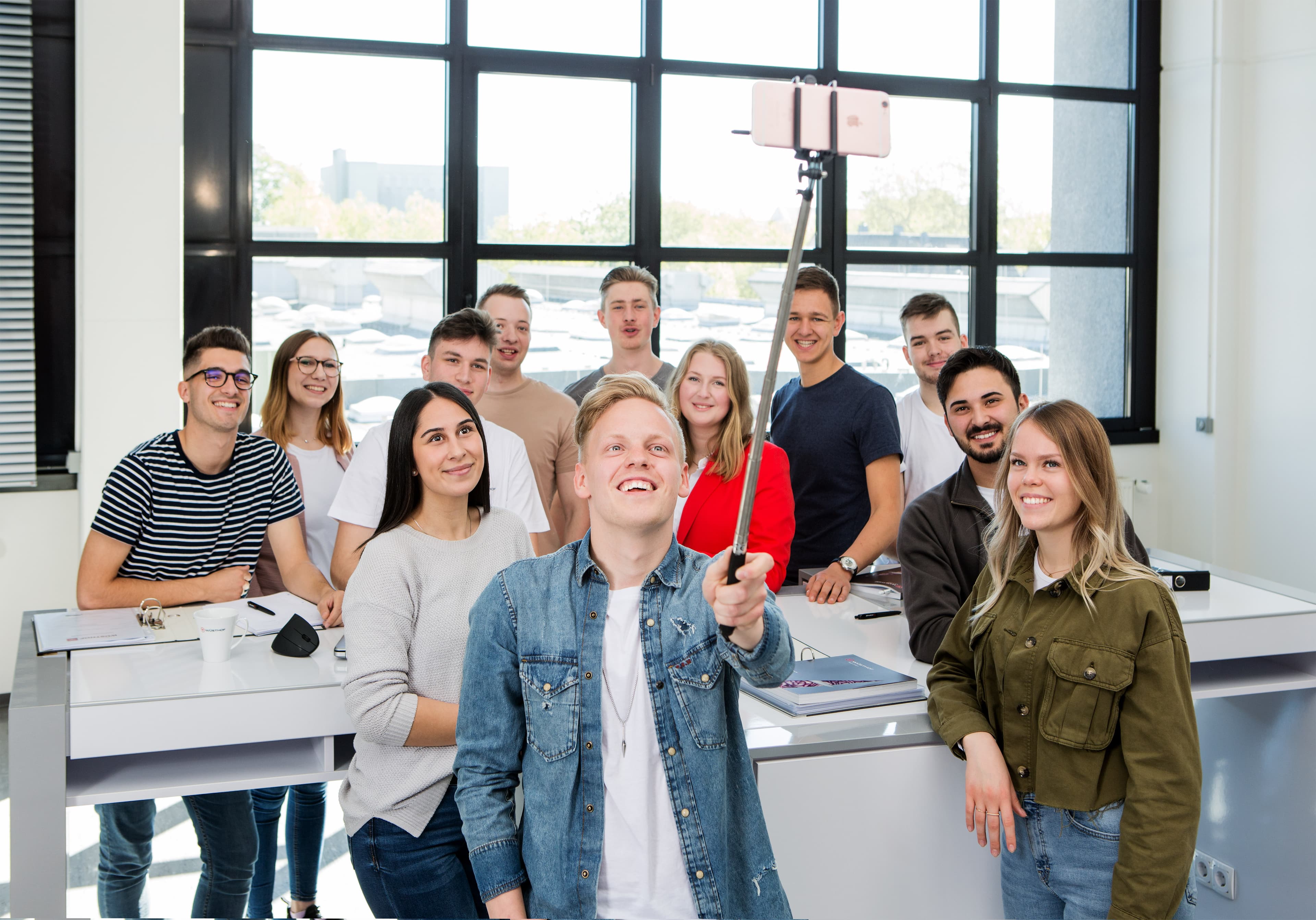 corporate young professionals taking a selfie at work