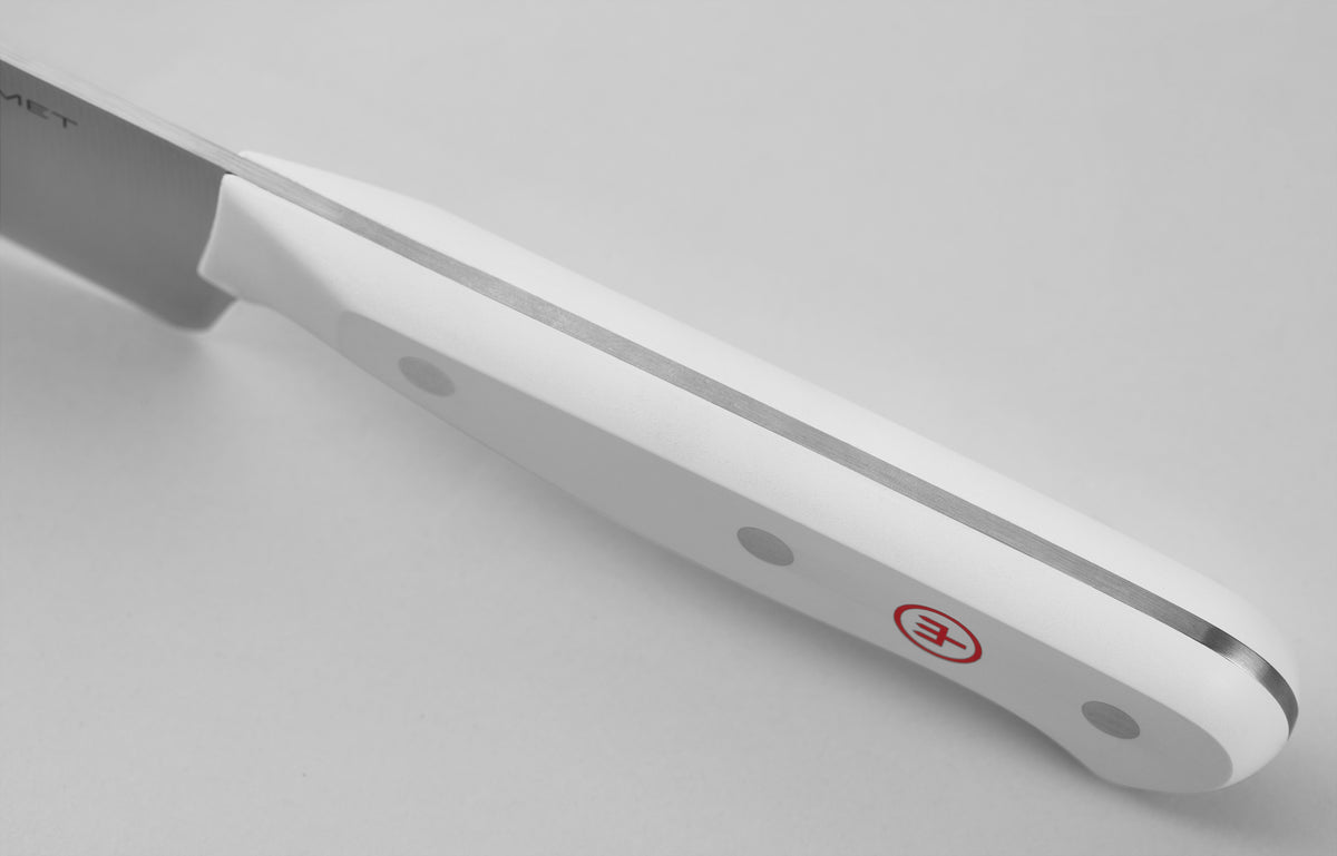 Gourmet 2 3/4" Trimming Knife featuring a close-up of a white ergonomic handle with three steel rivets and a subtle red logo, showcasing its full tang design.