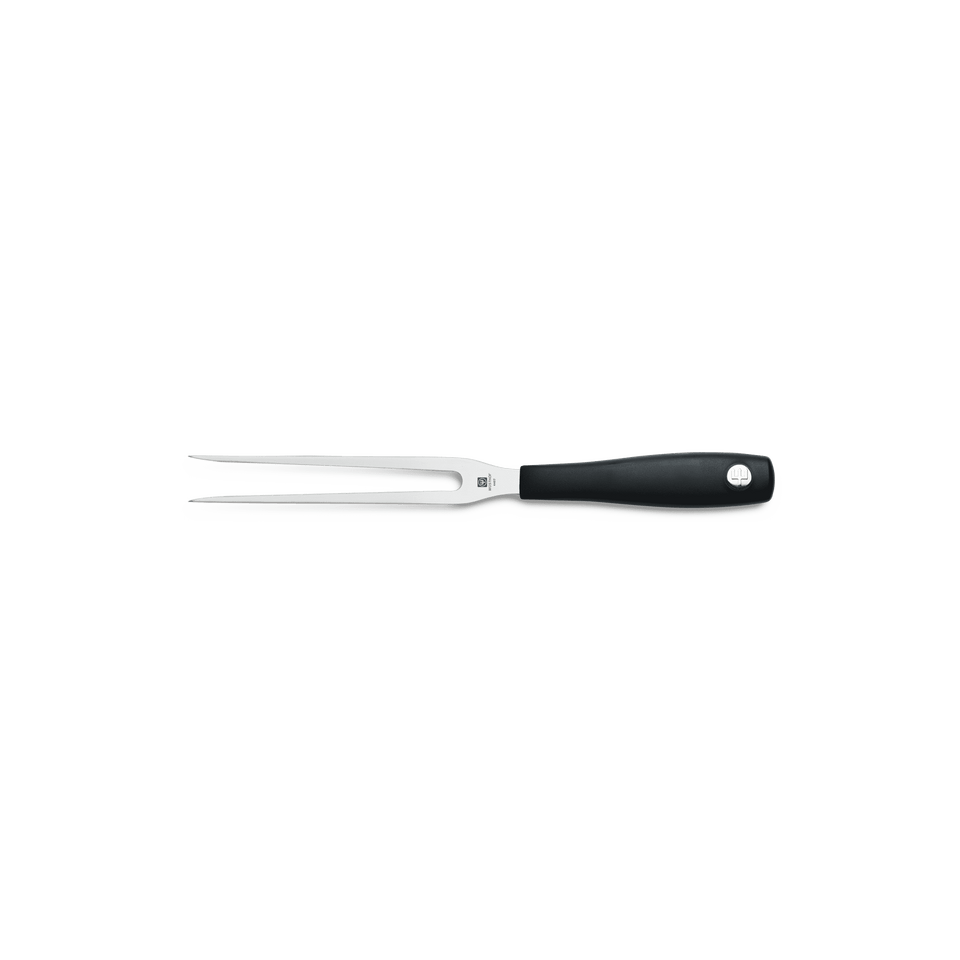 Black-handled fork on a green background