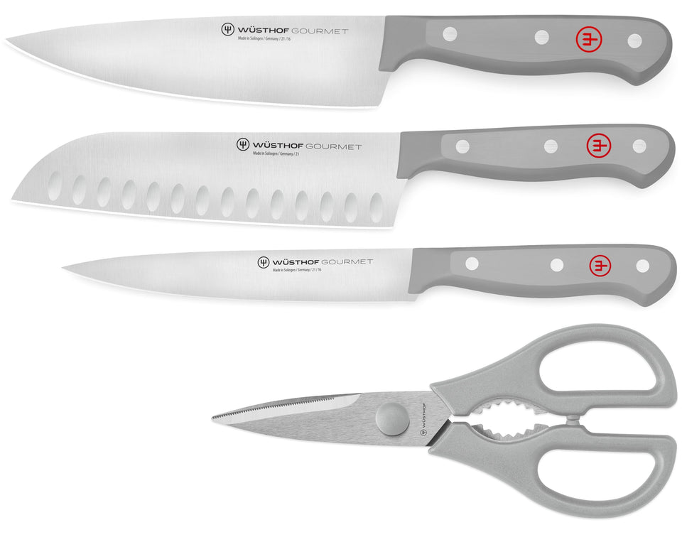 Set of Wüsthof Gourmet knives and shears on a white background