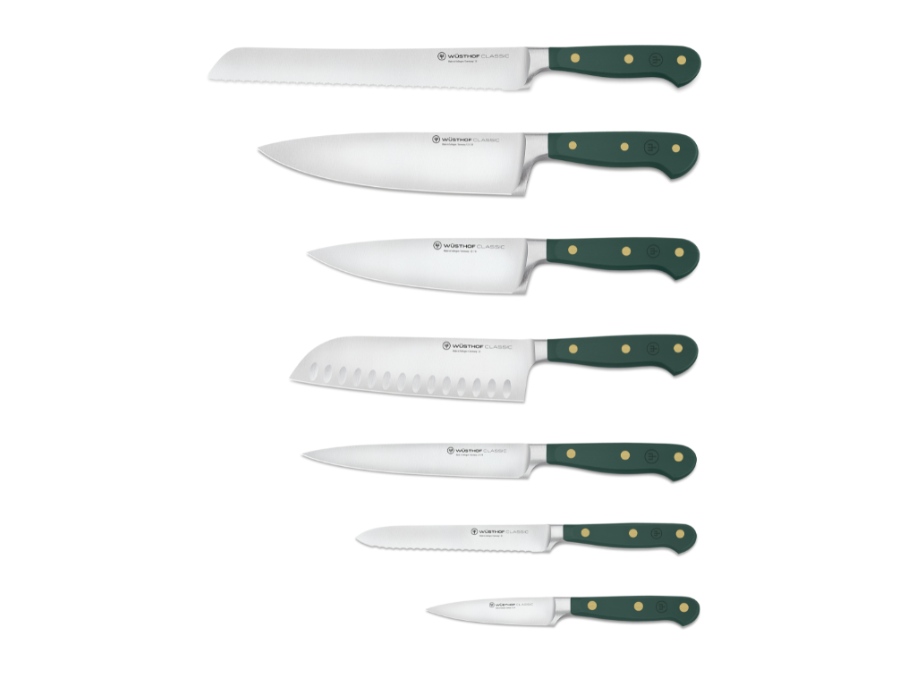 Set of knives with green handles on a white background