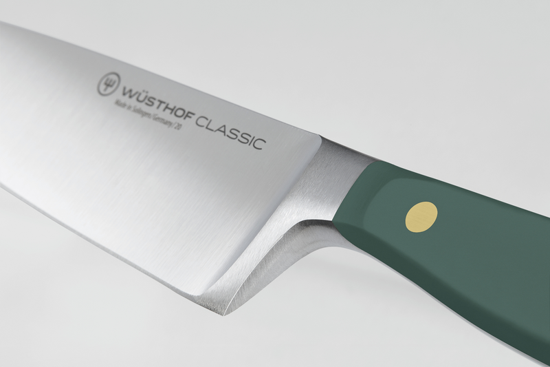 Wüsthof Classic knife with a green handle on a white background