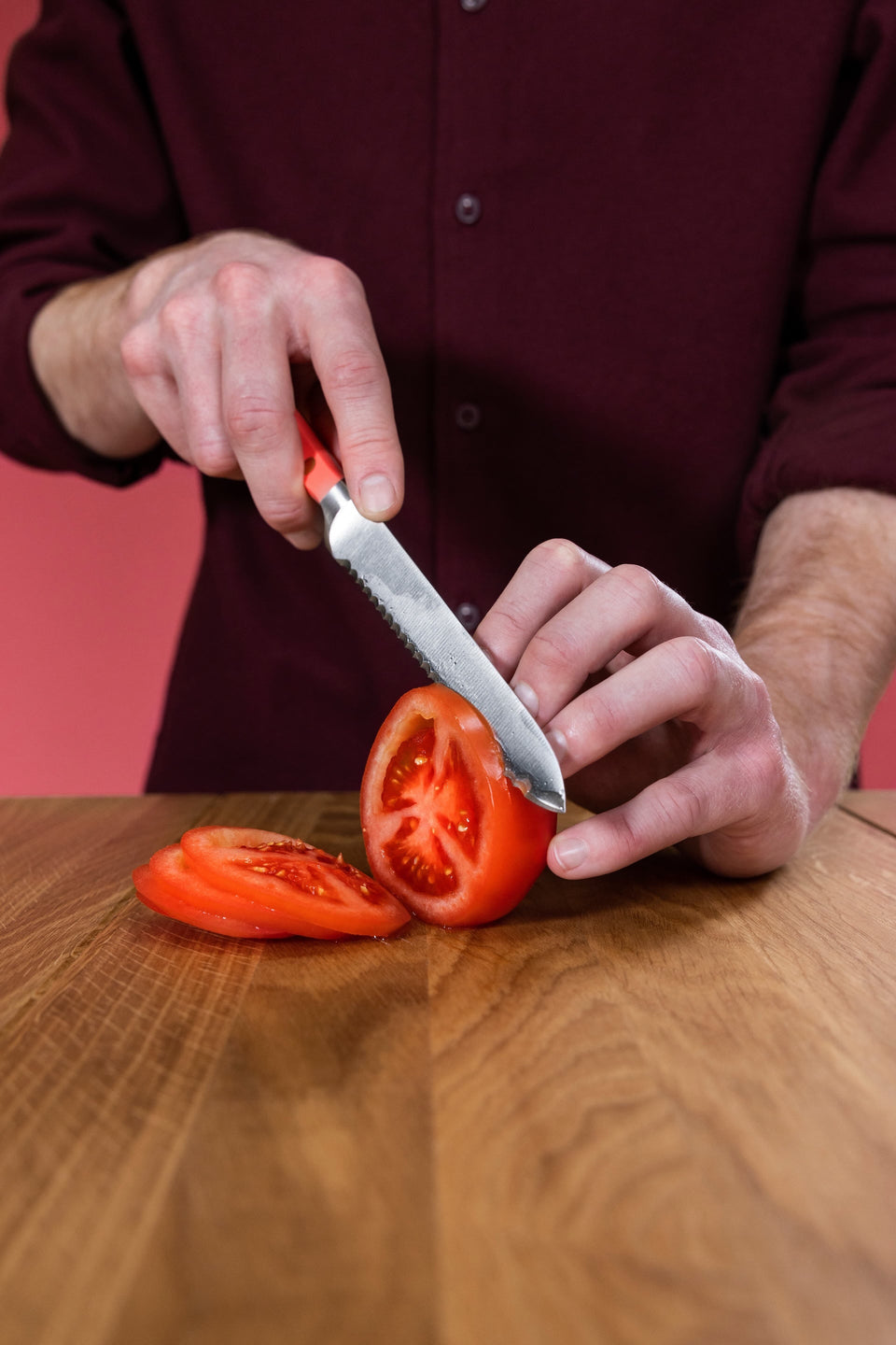 knife cutting tomato 