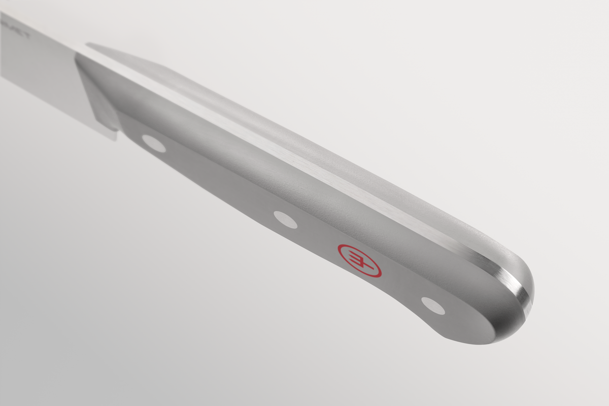 Stainless steel knife with a visible brand logo on a light gray background