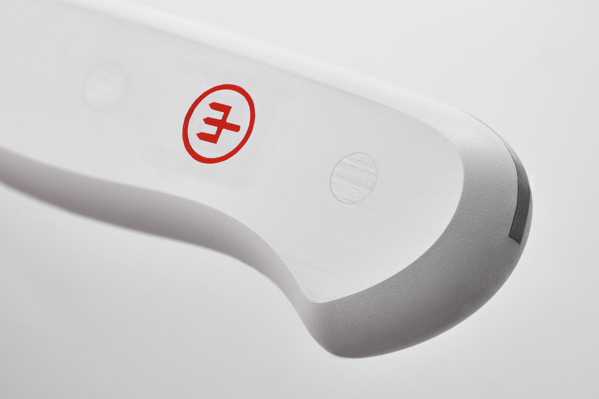 Gourmet 2 3/4" Trimming Knife close-up of white ergonomic handle with two steel rivets and red logo, showcasing its durable design.