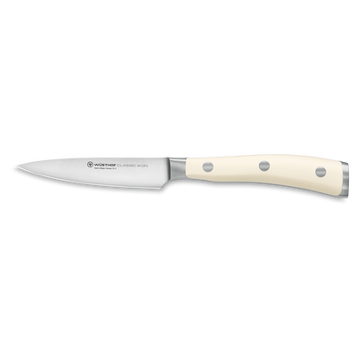 Classic Ikon 3 1/2" Paring Knife with a sharp forged German steel blade and smooth triple-riveted ivory handle for precise kitchen tasks.