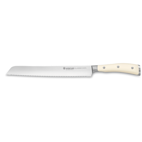 Classic Ikon 9" Precision Double-Serrated Bread Knife with a long forged German steel blade and smooth ivory triple-riveted handle for precise slicing.